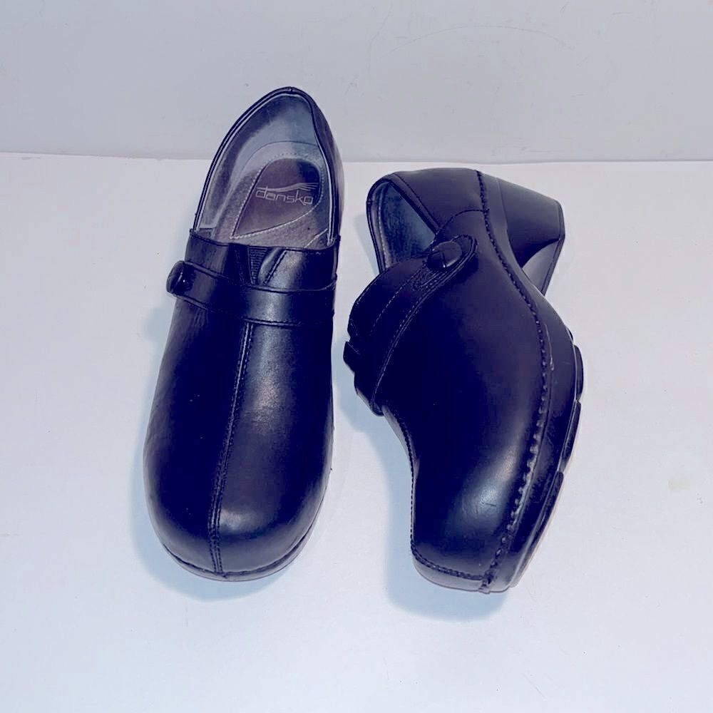 Dansko black leather clogs w/ button